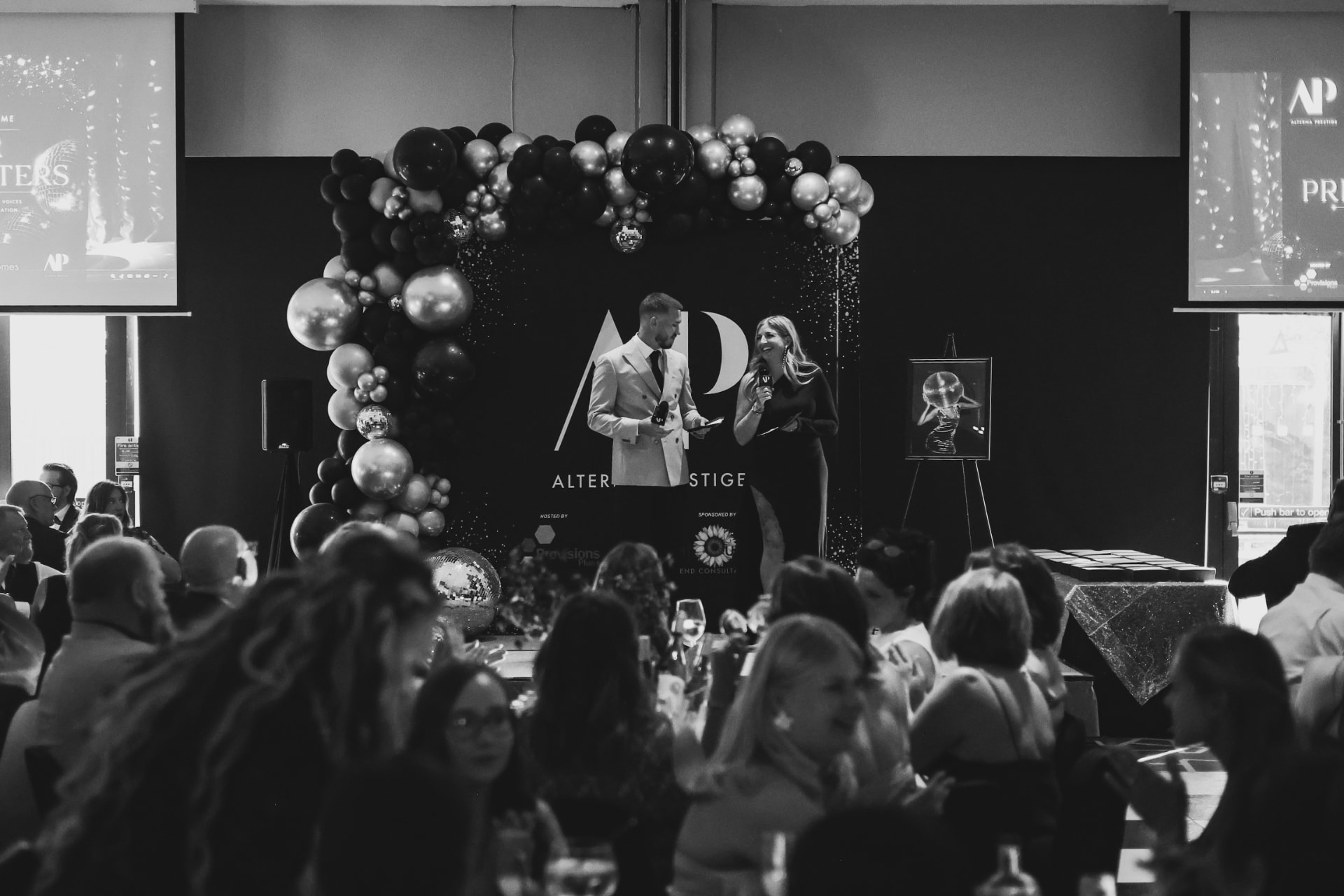 Alterna Prestige hosts on stage